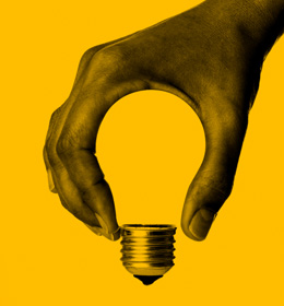 Hand creating the shape of a light bulb